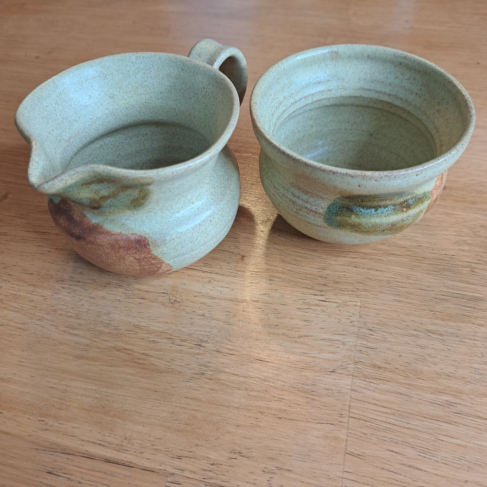 Signed pottery sugar and cream set
